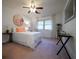 Bright bedroom with a floral wall decoration, natural light, and simple furnishings offers a cozy retreat at 3668 Kingsboro Ne Rd # 6, Atlanta, GA 30319