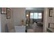 Bright dining area featuring a glass table, comfortable seating, and views into the living room at 3668 Kingsboro Ne Rd # 6, Atlanta, GA 30319