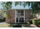 Charming brick multi-Gathering home with large windows and mature trees on a sunny day at 3668 Kingsboro Ne Rd # 6, Atlanta, GA 30319
