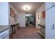 Hallway view showcasing the transition to a cozy living room with stylish furniture and natural light at 3668 Kingsboro Ne Rd # 6, Atlanta, GA 30319