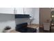 Functional kitchen featuring a sleek black range and white cabinetry with dining area adjacent at 3668 Kingsboro Ne Rd # 6, Atlanta, GA 30319