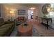 Comfortable living room boasts neutral furnishings, decorative art, and a view into the kitchen area at 3668 Kingsboro Ne Rd # 6, Atlanta, GA 30319