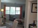 A view from the dining area featuring a glass table, comfortable seating, and the living room at 3668 Kingsboro Ne Rd # 6, Atlanta, GA 30319