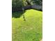 Fenced backyard featuring a green lawn at 4528 Baker Grove Nw Rd, Acworth, GA 30101