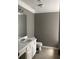 Bathroom featuring a white vanity, a toilet, and neutral paint at 4528 Baker Grove Nw Rd, Acworth, GA 30101