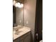 Bathroom featuring a single sink vanity, a large mirror, and neutral paint at 4528 Baker Grove Nw Rd, Acworth, GA 30101