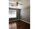 Bedroom with hardwood floors, a window, and neutral paint at 4528 Baker Grove Nw Rd, Acworth, GA 30101