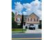 Inviting two-story home featuring a well-maintained yard, red shutters, and a two-car garage at 4528 Baker Grove Nw Rd, Acworth, GA 30101