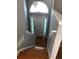 View of the tiled entry and staircase leading down to the front door of the home at 4528 Baker Grove Nw Rd, Acworth, GA 30101