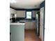A kitchen with a breakfast bar, stainless steel appliances, recessed lighting, and white cabinets at 4528 Baker Grove Nw Rd, Acworth, GA 30101