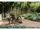 Charming backyard featuring a decorative bicycle, gravel path, and serene bamboo backdrop at 1050 E Club Ne Ln, Atlanta, GA 30319