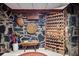 This wine cellar in the basement has a unique stone design and custom racks at 1050 E Club Ne Ln, Atlanta, GA 30319