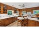 Bright kitchen with tile floors, wood cabinets, white countertops and modern appliances at 1050 E Club Ne Ln, Atlanta, GA 30319