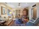 Cozy living room with hardwood floors, arm chair, sofa and large area rug at 1050 E Club Ne Ln, Atlanta, GA 30319