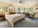 This main bedroom offers great natural lighting, a fan, and carpet at 1050 E Club Ne Ln, Atlanta, GA 30319
