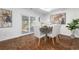 Dining room featuring a rustic table, modern art and sliding glass doors to the exterior at 2299 Brenda Se Dr, Smyrna, GA 30080
