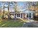 Inviting brick home showcasing a well-kept lawn and freshly painted white trim at 2299 Brenda Se Dr, Smyrna, GA 30080