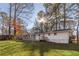 Well-maintained single-story home featuring a backyard deck and screened porch at 2299 Brenda Se Dr, Smyrna, GA 30080