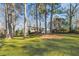 Ranch style home with mature trees and expansive grassy yard at 2299 Brenda Se Dr, Smyrna, GA 30080