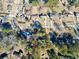 An aerial view of a wooded property with a home outlined in red at 3281 Old Salem Rd, Conyers, GA 30013