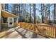 Spacious wooden back deck, perfect for outdoor entertaining, with views of the private, tree-lined backyard at 3281 Old Salem Rd, Conyers, GA 30013