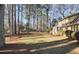 Expansive backyard with mature trees and a well-kept lawn, providing ample space for outdoor activities and relaxation at 3281 Old Salem Rd, Conyers, GA 30013