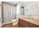 Bathroom with a sink with a wood vanity, large mirror and a shower/tub combination at 3281 Old Salem Rd, Conyers, GA 30013
