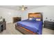 Bedroom with a large bed, neutral walls and light gray wood-look flooring at 3281 Old Salem Rd, Conyers, GA 30013