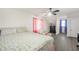 Bedroom with a ceiling fan, light walls and light gray wood-look flooring at 3281 Old Salem Rd, Conyers, GA 30013