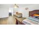 Spacious bedroom features wood floors, a ceiling fan, and a cozy sitting area at 3281 Old Salem Rd, Conyers, GA 30013