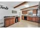 Charming kitchen showcasing wood cabinets and an eat-in bar, creating a warm and inviting space at 3281 Old Salem Rd, Conyers, GA 30013