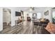 Inviting living room with hardwood floors, a stone fireplace, and comfortable furnishings, perfect for relaxation at 3281 Old Salem Rd, Conyers, GA 30013