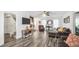 Bright living room with hardwood floors, a stone fireplace, and ample natural light, creating a cozy atmosphere at 3281 Old Salem Rd, Conyers, GA 30013