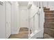 Bright stairway featuring hardwood flooring and carpeted steps, leading to the upper level at 3281 Old Salem Rd, Conyers, GA 30013