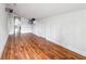 Laminate floored bonus room features white walls with doorway access to another room at 845 James Path Ct, Lawrenceville, GA 30044