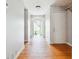 Bright hallway boasts hardwood floors and an open doorway leading to the backyard at 845 James Path Ct, Lawrenceville, GA 30044
