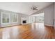 Spacious living room with a fireplace, multiple windows, and hardwood floors at 845 James Path Ct, Lawrenceville, GA 30044