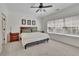 Bedroom with a queen bed, a ceiling fan, carpet, and two windows for natural lighting at 971 Thibideau Ct, Sandy Springs, GA 30328