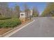 Community entrance with signage and landscaping, adding prestige and curb appeal to the neighborhood at 971 Thibideau Ct, Sandy Springs, GA 30328