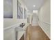 Bright foyer with hardwood floors, staircase, and stylish decor leading to the upper level at 971 Thibideau Ct, Sandy Springs, GA 30328