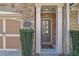 Inviting front door with stone accents and a charming 'Welcome' mat at 971 Thibideau Ct, Sandy Springs, GA 30328