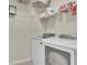Well-equipped laundry room with washer, dryer, and shelving at 971 Thibideau Ct, Sandy Springs, GA 30328