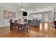 This open living area has hardwood floors, a fireplace, a large window and a dining table at 971 Thibideau Ct, Sandy Springs, GA 30328
