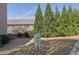 Designated pet relief area near residential buildings with lawn and trees at 971 Thibideau Ct, Sandy Springs, GA 30328
