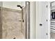 Shower with a glass door, rain-style shower head, and built-in bench in a remodeled bathroom at 971 Thibideau Ct, Sandy Springs, GA 30328