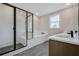 Modern bathroom with walk-in shower, soaking tub, dual vanities, and sleek finishes at 2568 Silver Star Ne Dr, Marietta, GA 30066
