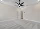 Carpeted bedroom offers natural light and a ceiling fan at 2568 Silver Star Ne Dr, Marietta, GA 30066