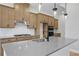 Close-up of the kitchen with a modern island, stainless steel appliances, and a tile backsplash at 2568 Silver Star Ne Dr, Marietta, GA 30066