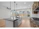 Well-lit kitchen with stainless steel appliances, an island, and windows providing natural light at 2568 Silver Star Ne Dr, Marietta, GA 30066