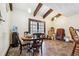 Cozy dining room with rustic beams and wood flooring at 270 Oak Ridge Rd, Covington, GA 30016